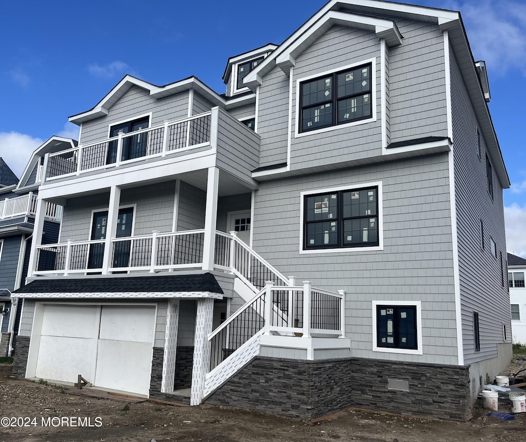 1611 Ocean Ave, Point Pleasant Beach, NJ 08742 - view of front of property with a balcony, an attached garage, and stairs
