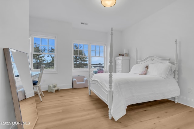 bedroom with light hardwood / wood-style flooring