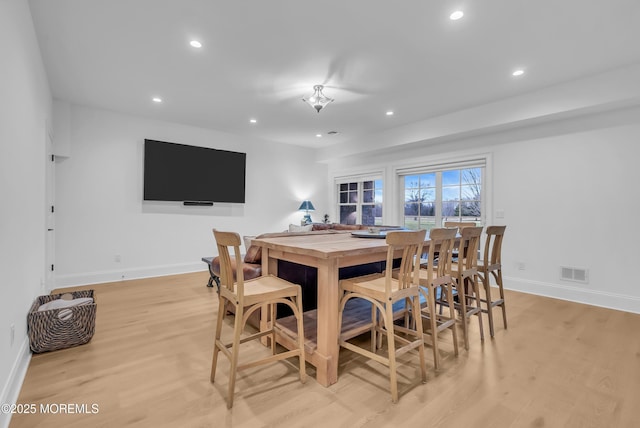 dining space with light wood-type flooring