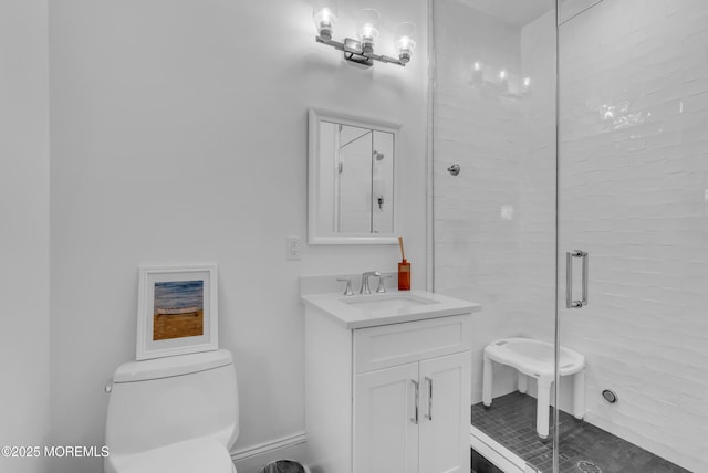 bathroom with vanity, toilet, and walk in shower