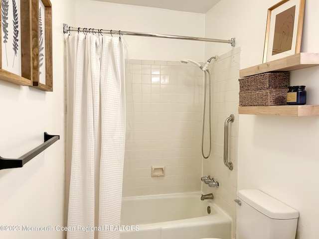 bathroom with toilet and shower / bath combo