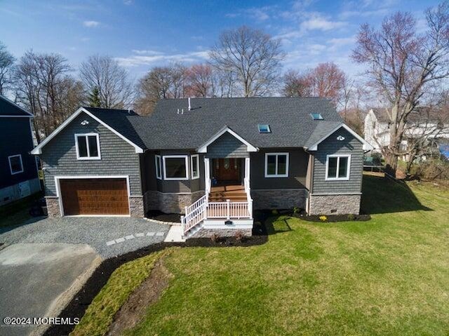 view of front of home featuring a garage and a front lawn