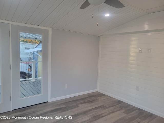 spare room with vaulted ceiling, ceiling fan, dark hardwood / wood-style floors, and wood ceiling