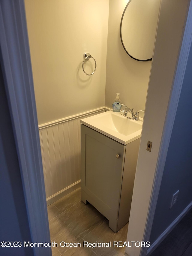 bathroom with vanity with extensive cabinet space and tile floors