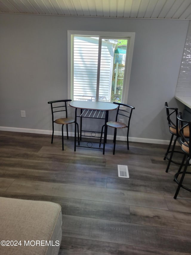 living area with dark hardwood / wood-style flooring