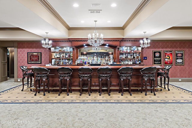 bar with crown molding and pendant lighting