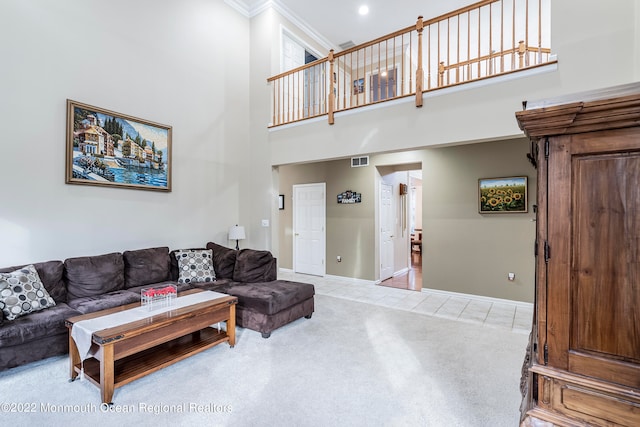 carpeted living room featuring ornamental molding and a towering ceiling