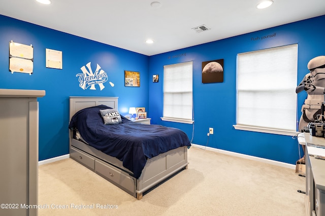 bedroom with light carpet