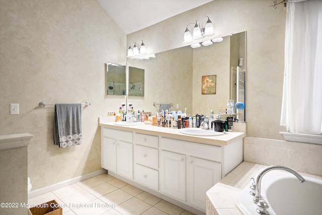 bathroom featuring dual sinks, tile flooring, vaulted ceiling, a relaxing tiled bath, and large vanity