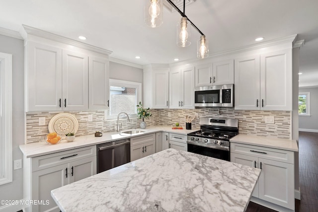 kitchen with dark wood-style floors, white cabinets, a sink, backsplash, and stainless steel appliances