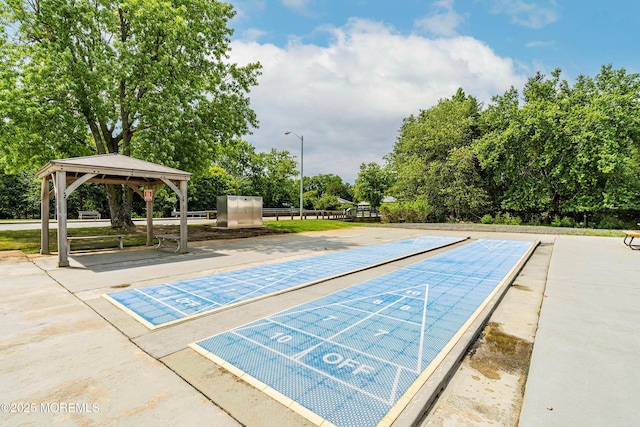 view of home's community with a gazebo and shuffleboard