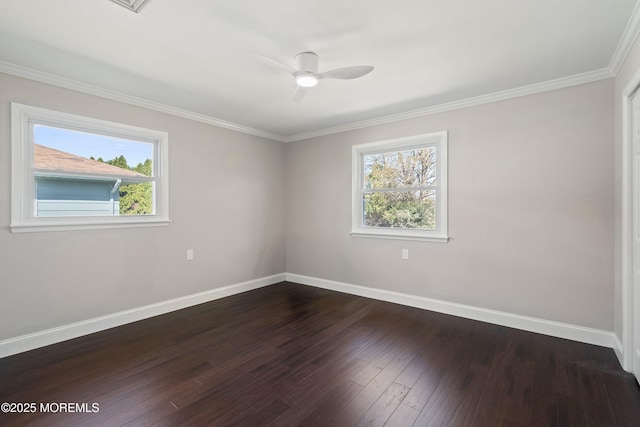 empty room with baseboards, ceiling fan, and a wealth of natural light