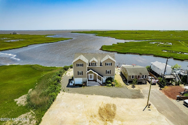 bird's eye view featuring a rural view and a water view