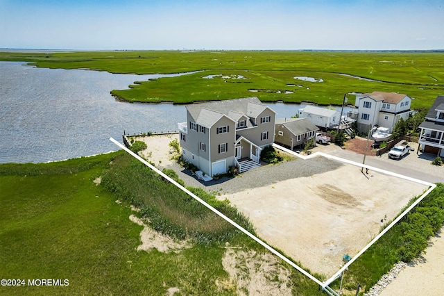 drone / aerial view with a water view and a rural view