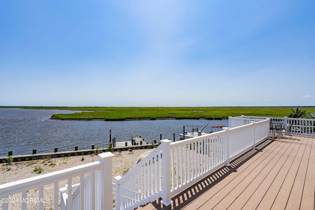 wooden terrace with a water view