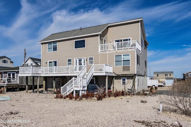 rear view of house featuring a deck