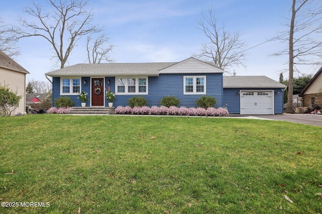 ranch-style home featuring a garage and a front lawn