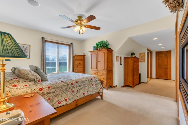 bedroom featuring light carpet and ceiling fan