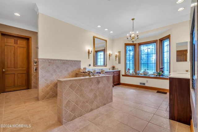 bathroom featuring vanity, a chandelier, ornamental molding, and tile patterned flooring