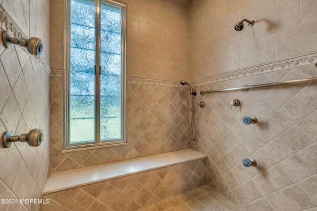 bathroom featuring tiled shower