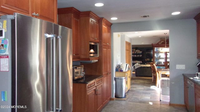 kitchen featuring appliances with stainless steel finishes and light tile flooring