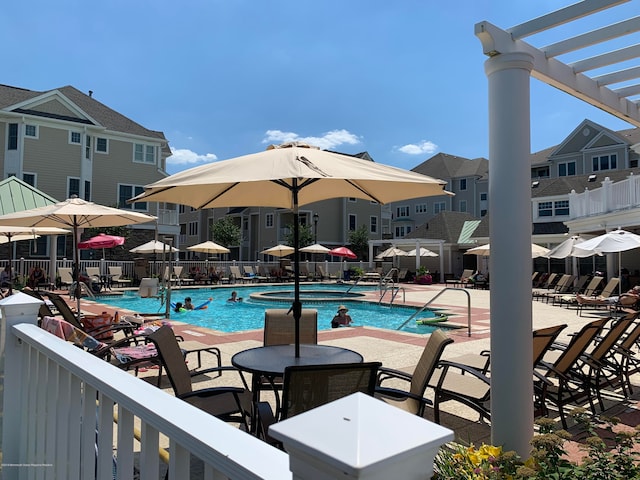 22 Cooper Ave Unit 105, Long Branch, NJ 07740 - view of swimming pool featuring a pergola and a patio area