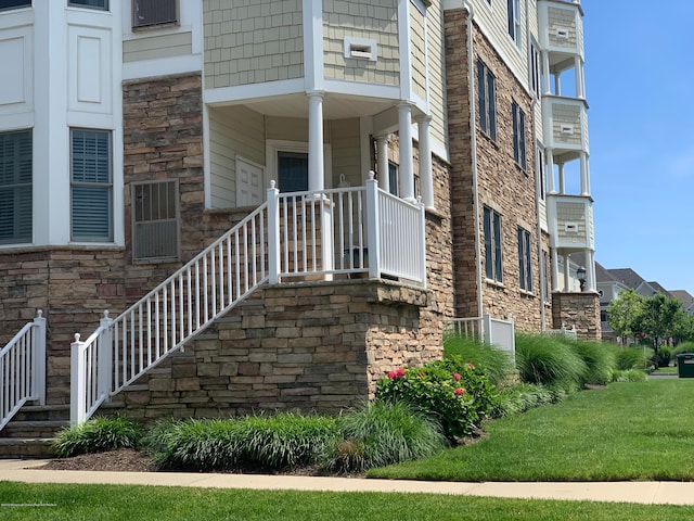 22 Cooper Ave Unit 105, Long Branch, NJ 07740 - doorway to property with a yard