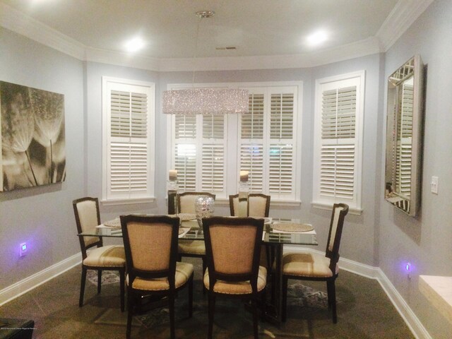 22 Cooper Ave Unit 105, Long Branch, NJ 07740 - dining area featuring crown molding and dark colored carpet