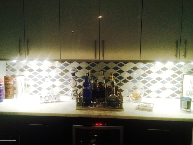 22 Cooper Ave Unit 105, Long Branch, NJ 07740 - kitchen featuring wine cooler, light stone countertops, and tasteful backsplash