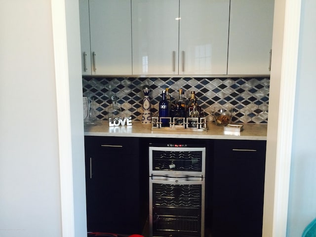 22 Cooper Ave Unit 105, Long Branch, NJ 07740 - bar with tasteful backsplash and wine cooler