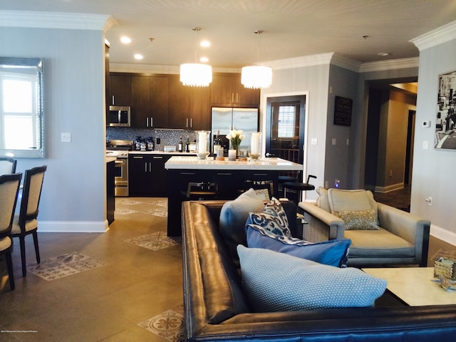 22 Cooper Ave Unit 105, Long Branch, NJ 07740 - kitchen with appliances with stainless steel finishes, ornamental molding, pendant lighting, dark brown cabinets, and tasteful backsplash