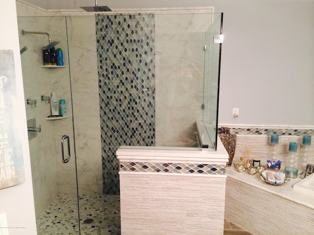 22 Cooper Ave Unit 105, Long Branch, NJ 07740 - bathroom featuring tile walls and walk in shower