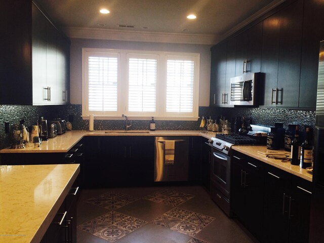 22 Cooper Ave Unit 105, Long Branch, NJ 07740 - kitchen with crown molding, sink, tasteful backsplash, and stainless steel appliances