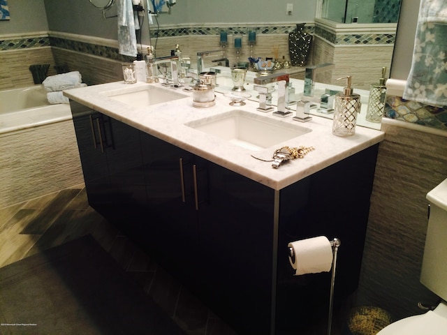 22 Cooper Ave Unit 105, Long Branch, NJ 07740 - bathroom with tile walls and double sink vanity