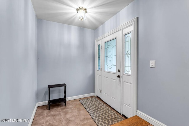 entryway featuring light tile patterned flooring