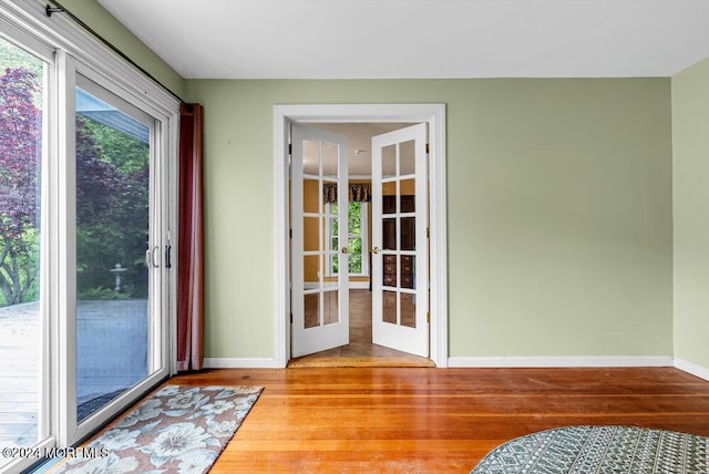 entryway featuring french doors and hardwood / wood-style floors