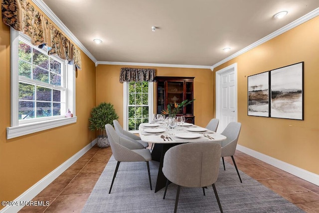 tiled dining area featuring a wealth of natural light and crown molding