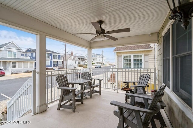 exterior space with a residential view and ceiling fan