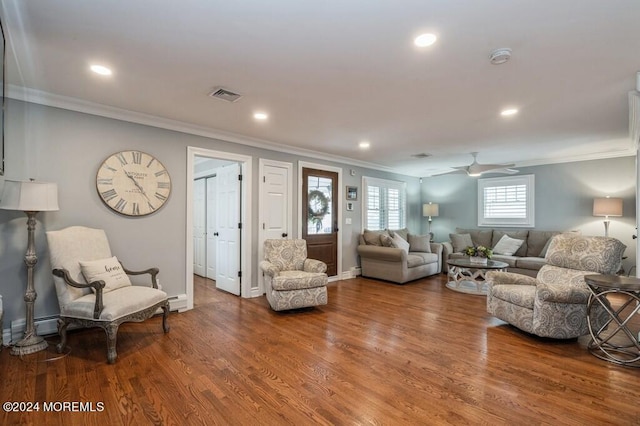 living area with crown molding, recessed lighting, wood finished floors, and visible vents