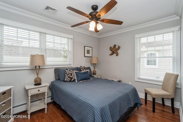 bedroom featuring wood finished floors, baseboards, visible vents, ornamental molding, and a baseboard heating unit