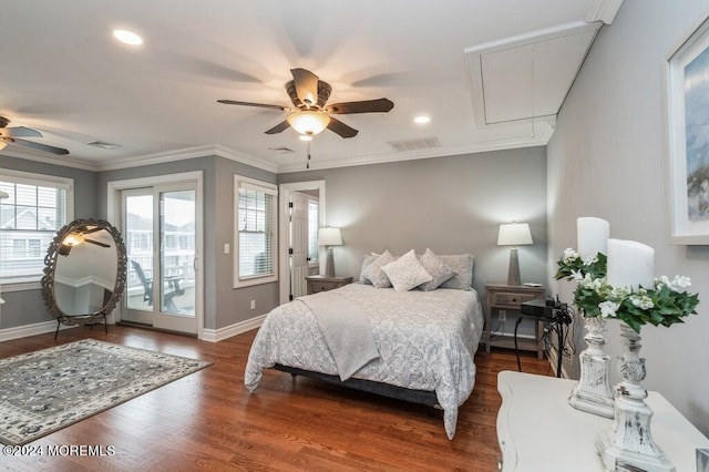 bedroom with wood finished floors, visible vents, baseboards, attic access, and access to outside