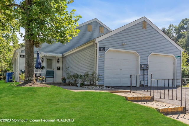 view of front facade with a garage and a front lawn