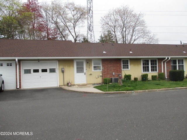 ranch-style house featuring a garage