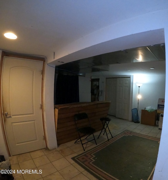 basement with light tile patterned floors