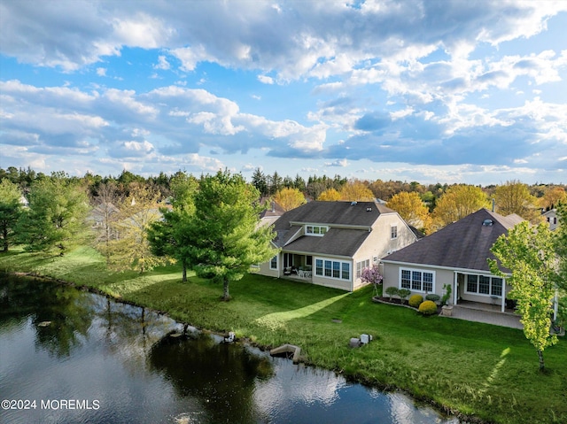 birds eye view of property with a water view