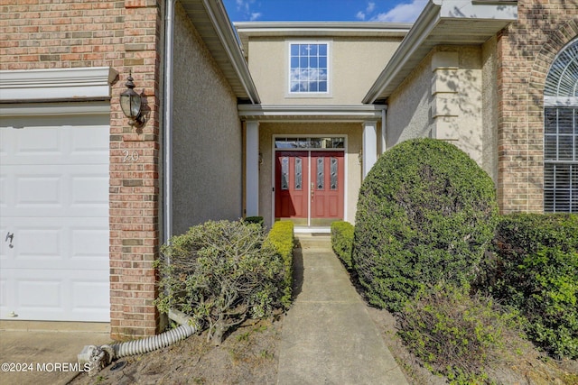 entrance to property featuring a garage