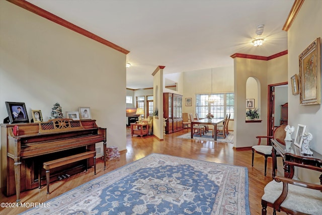 interior space with crown molding and hardwood / wood-style flooring