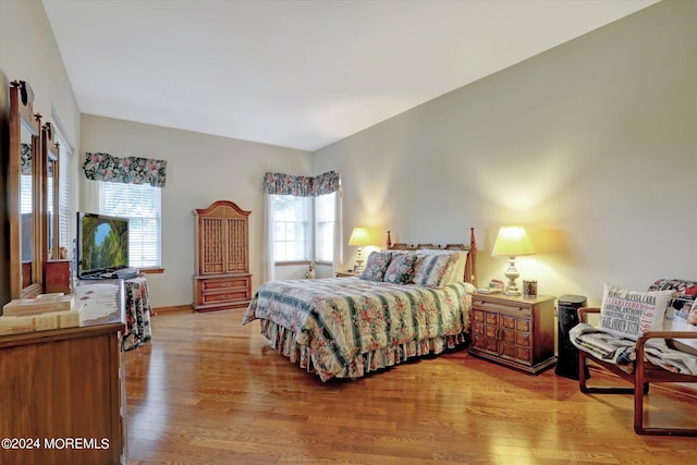 bedroom with wood-type flooring