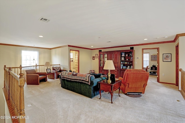 living room with crown molding and light colored carpet