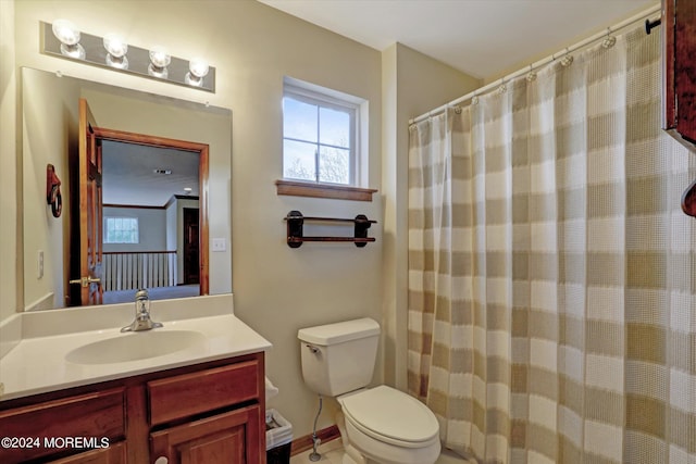 bathroom featuring toilet and oversized vanity